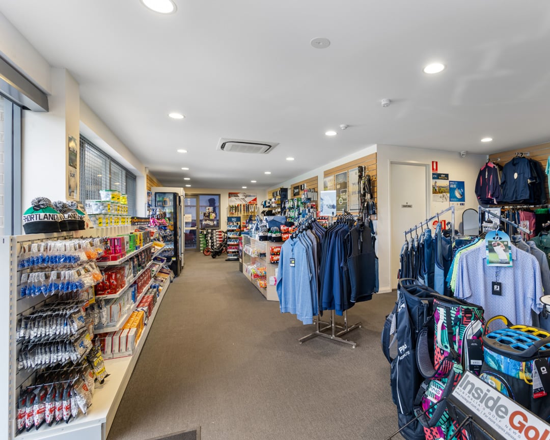 Golf clothing snacks and equipment inside the pro shop at Shortland Waters golf club